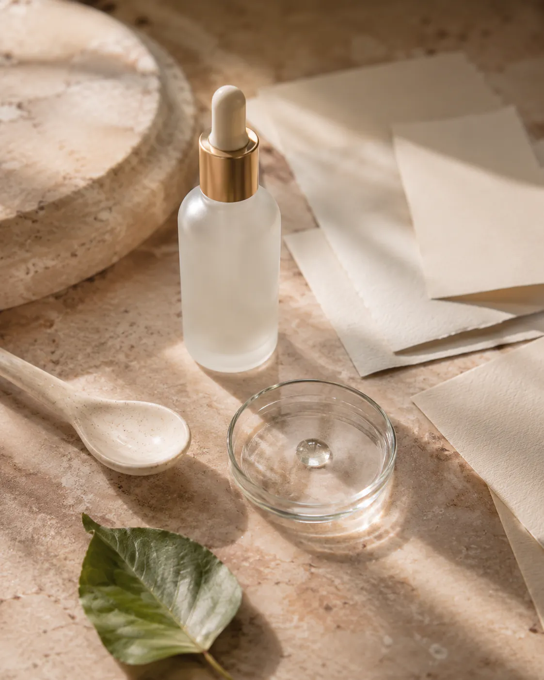 Ingredient-led beauty layout with labels and neutral product packaging.